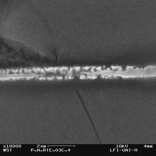 Figure: SEM image of a fault due to electromigration in a copper interconnect with the passivation layer removed